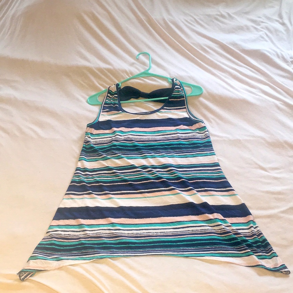 Adorable slinky tank with bow detail.